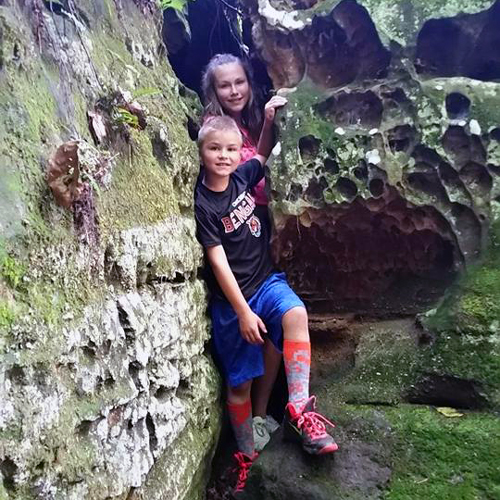 children going through rock squeeze at high rock adventures, hocking hills Ohio